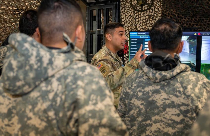 Silguero trains chemical soldiers to use the video being transmitted to them by a man transportable robotic system to perform site exploration in February at Fort Leonard Wood. Credit: U.S. Army photo by Melissa Buckley