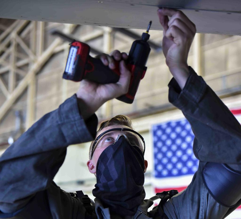 An airman performs maintenance on a KC-135 Stratotanker while wearing an exoskeleton. This apparatus is used to relieve pressure off of the shoulders and back. Credit: Airman 1st Class Kiaundra Miller, U.S. Air Force