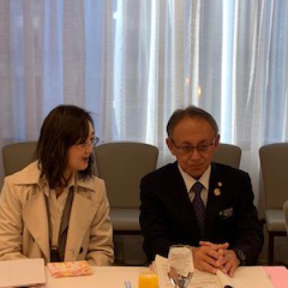 Japan's Governor of Okinawa Prefecture, Denny Tamaki (r), sitting next to his interpreter, Hiroko Tamaki, speaks to reporters at the Defense Writers Group on March 8 in Washington, D.C.