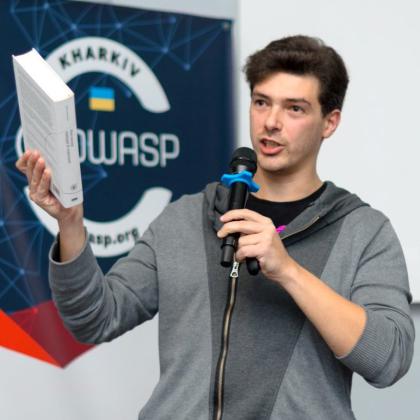 Oleksandr Adamov, associate professor and cybersecurity researcher at Kharkiv National University of Radio Electronics, speaks at a conference in Kharkiv. Credit: Oleksandr Adamov
