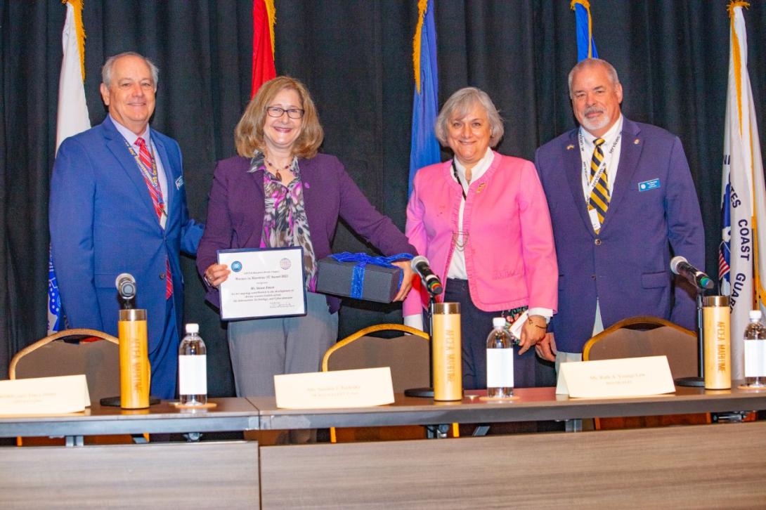 Director of Diversity Susan Emert, second from left, receives the inaugural Women in Maritime IT Award from the Hampton Roads Chapter. 