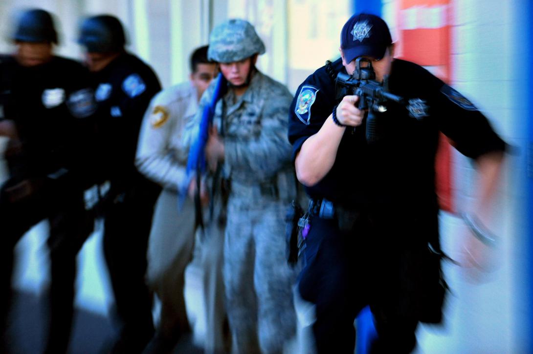A Las Vegas based law enforcement team partakes in an active shooter exercise near Nellis Air Force Base, Nevada. Photo by Staff Sgt. William Coleman, Nellis AFB Public Affairs. 03.28.2012