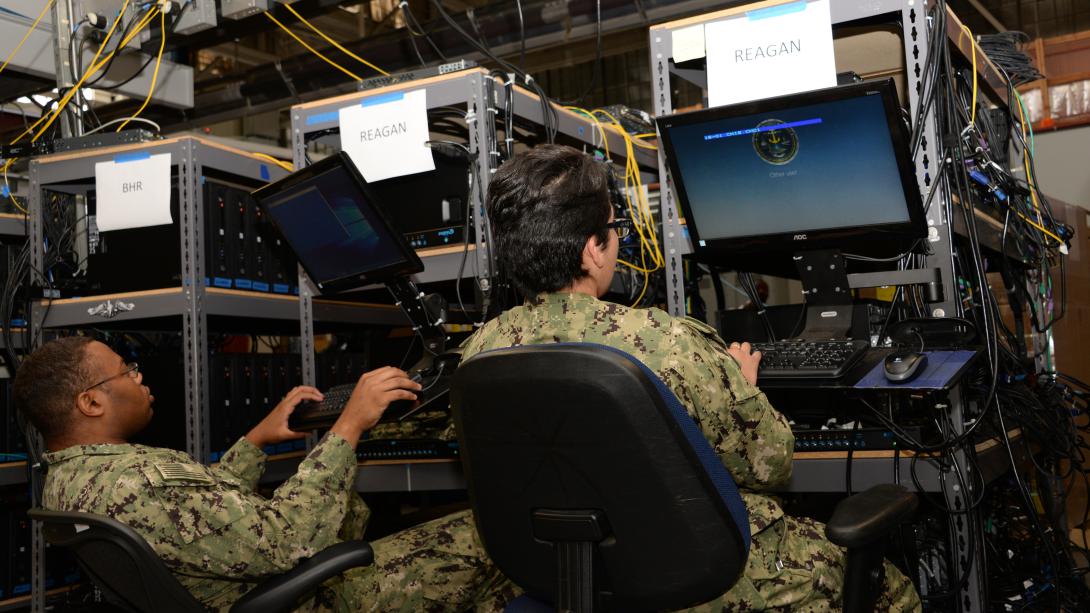 USS Ronald Reagan Sailors Work train for cyber readiness. Photo By: Rick Naystatt, U.S. Navy.