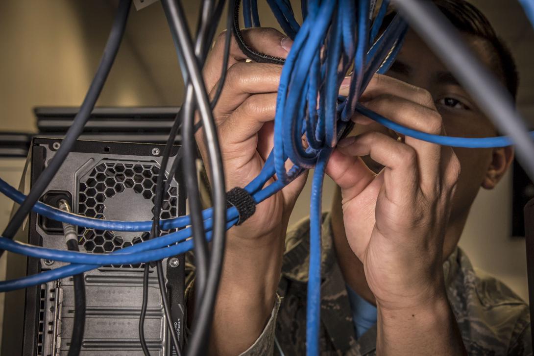 Air Force Airman 1st Class Zachary Brown configures a network switch at the 179th Airlift Wing in Mansfield, Ohio, January 26, 2018. The Defense Information Systems Agency, which provides information technology solutions for the Defense Department, has released its 2023 Contracts Guide. Photo by: Air Force Tech Sgt. Joe Harwood