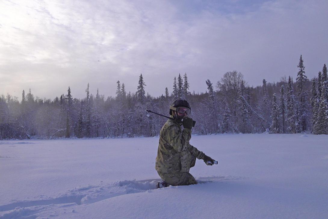 Alaska Air National Guard Tech. Sgt. Matthew O'Brien practices radio communications in Alaska, January 21, 2022. The Joint Tactical Networking Center focuses on interoperability and resiliency challenges for software-defined radios and waveforms. Photo By: Air Force Senior Airman Kelly Willett