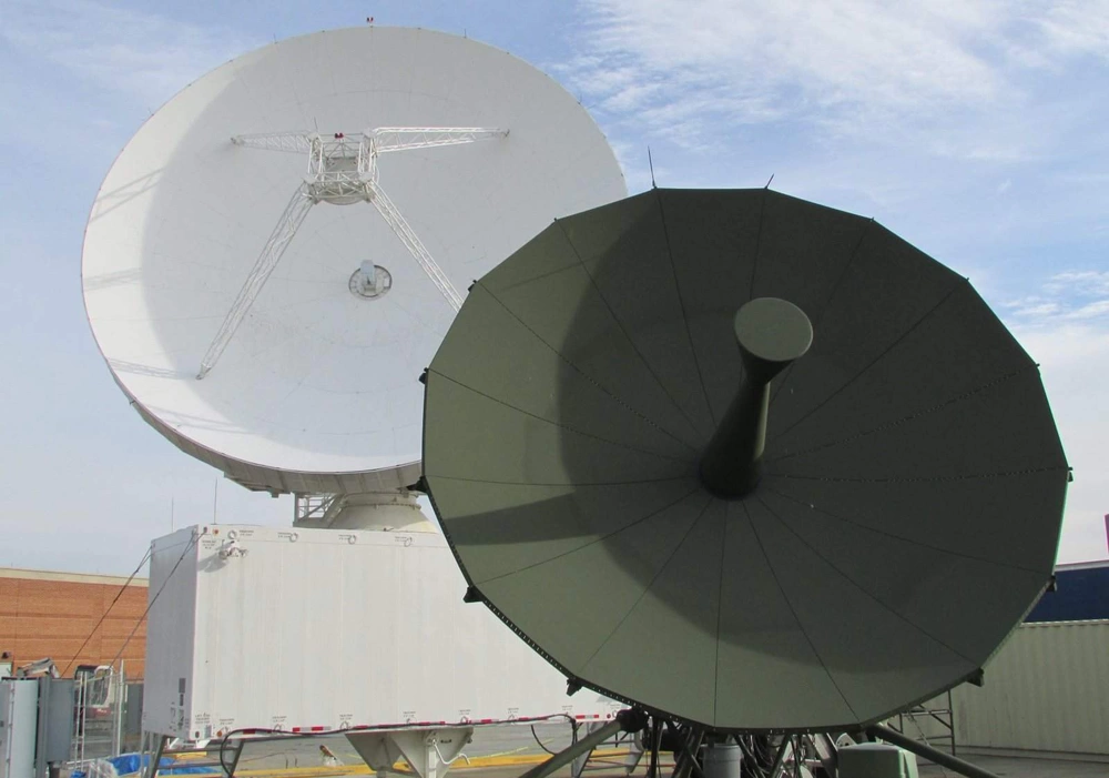 Two terminal dishes assist Army space soldiers of Alpha Company, 53rd Signal Battalion (SATCON) at the Wideband Satellite Communications Operations Center, Fort Detrick, Maryland. This facility provides Alpha Company controllers increased capabilities to control the communications payloads and communications transmissions of the Defense Satellite Communication System and Wideband Global Satellite (WGS) constellations. Credit: U.S. Army Garrison - Fort Detrick