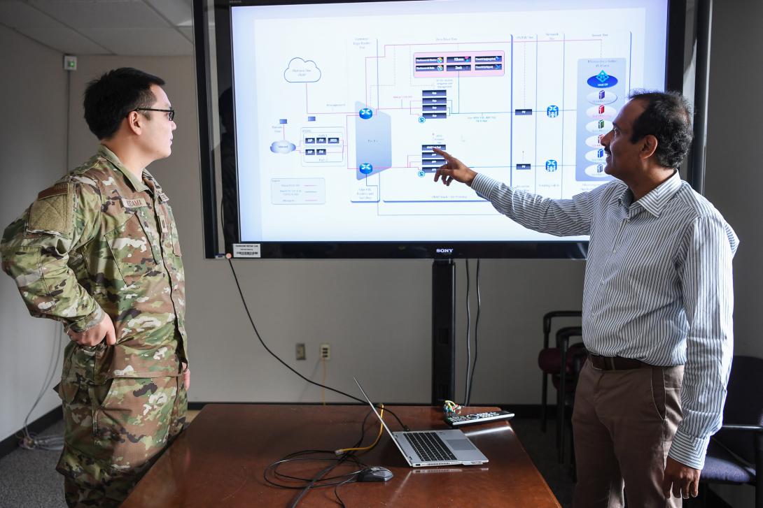 Implementing new technologies implies bringing together many components and people. Credit: Mark Herlihy, U.S. Air Force