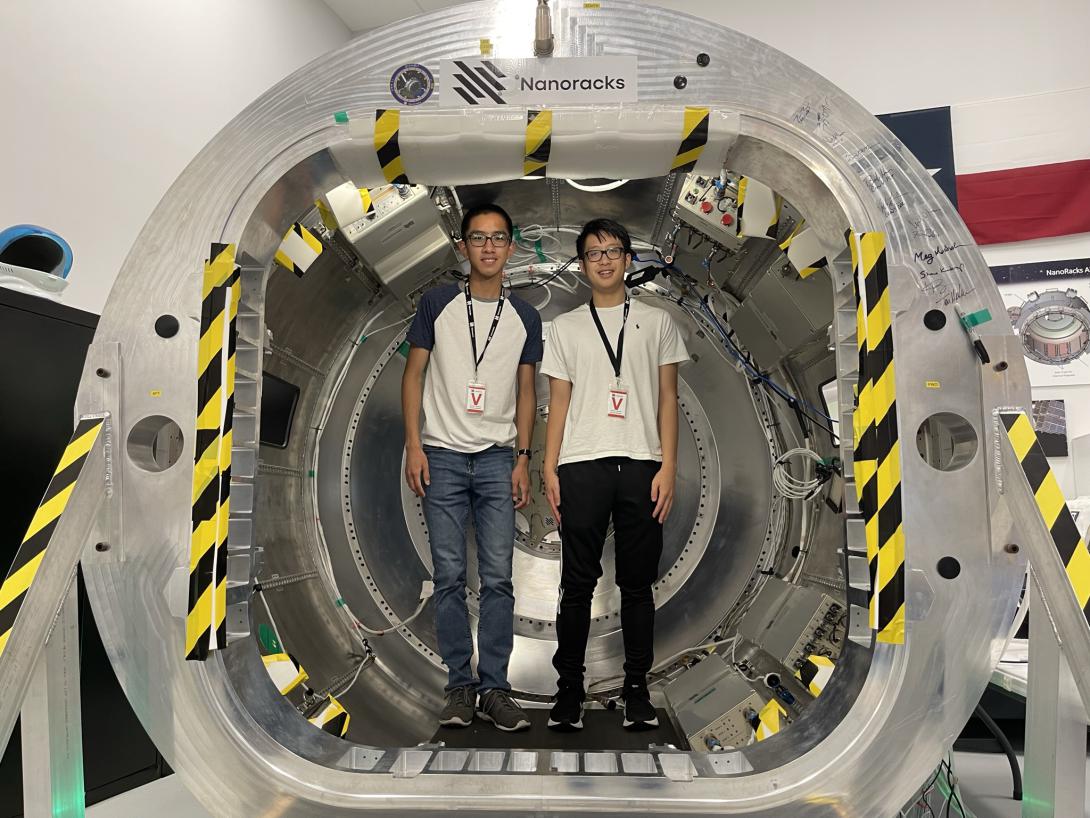 Alan Hsu and Khoi Dinh, members of TJ Space, standing in Nanoracks Bishop airlock in Webster, TX.