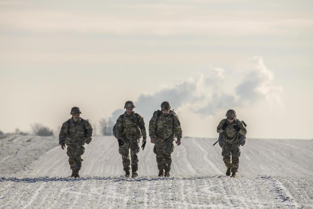 Soldiers walk to a meeting point after jumping off an Air Force C-130 Hercules in the Alzey drop zone in Germany, December 16, 2022. The Army Vantage program, which analyzes data to support a wide range of warfighter needs, may be recompeted in the coming months to bring on multiple vendors. Credit: Volker Ramspott, U.S. Army