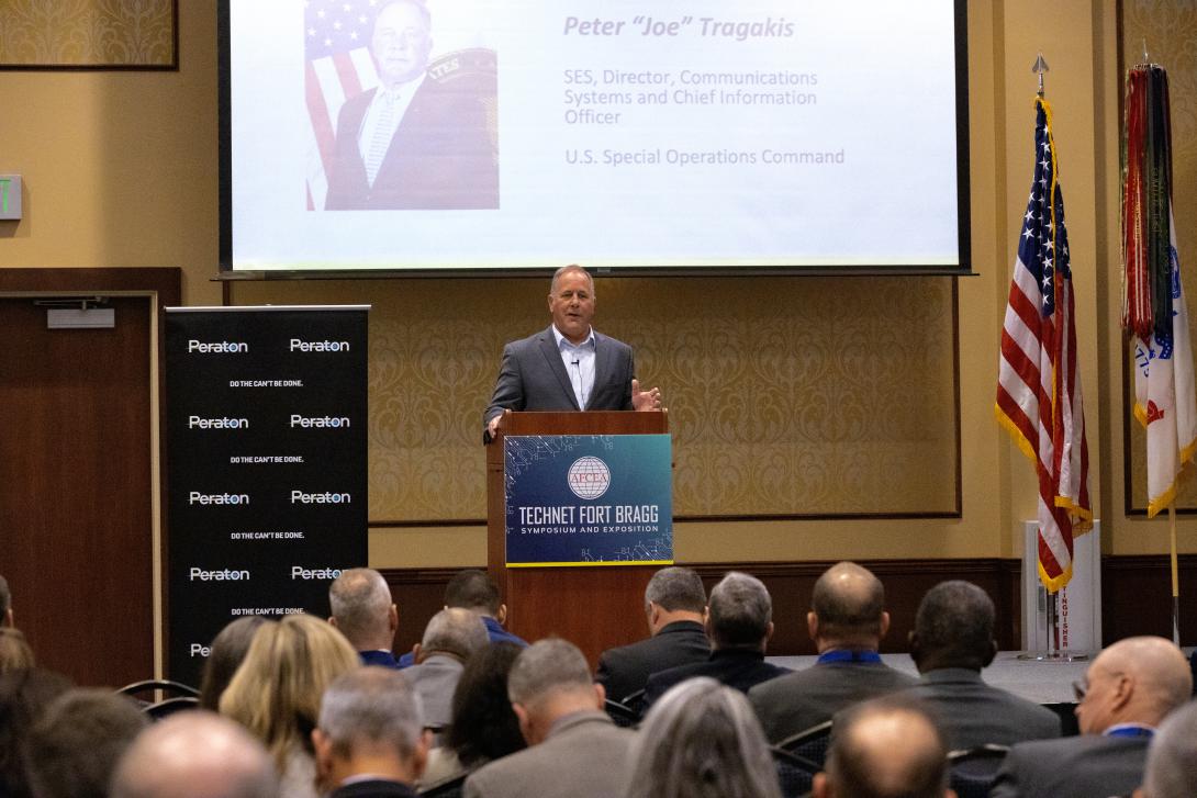 Keynote speaker Peter J. Tragakis presents to a packed room at the annual TechNet Fort Bragg Symposium and Exposition 2023.