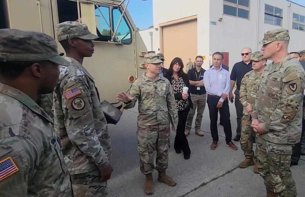 Army Capt. Jacob Soler (c), commander of the battalion logistics company, 2nd Armored Brigade Combat Team, 3rd Infantry Division showcases different technologies in the U.S. Army's Prognostics and Predictive Maintenance Program, or PPMx, to leaders at Fort Stewart in 2022. The military needs a comprehensive strategy, experts say, to fully harness advanced technologies related to command and control. Credit: Staff Sgt. Justin McClarran