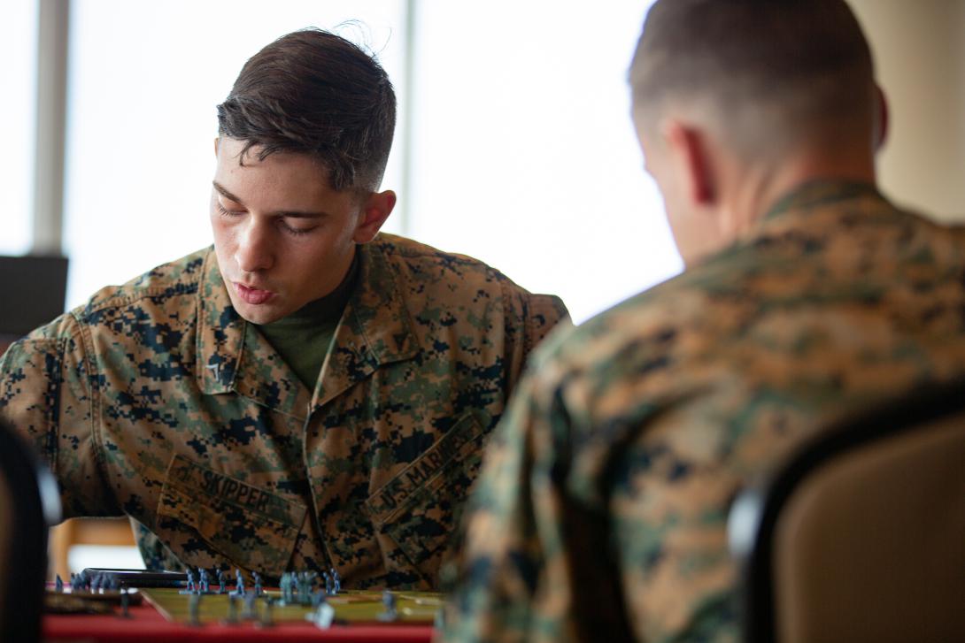 A U.S. Marine plays a war-themed strategy board game based on World War II battles in Camp Schwab, Okinawa, Japan in 2019. Credit: Cpl. Timothy Hernandez, U.S. Marine Corps.