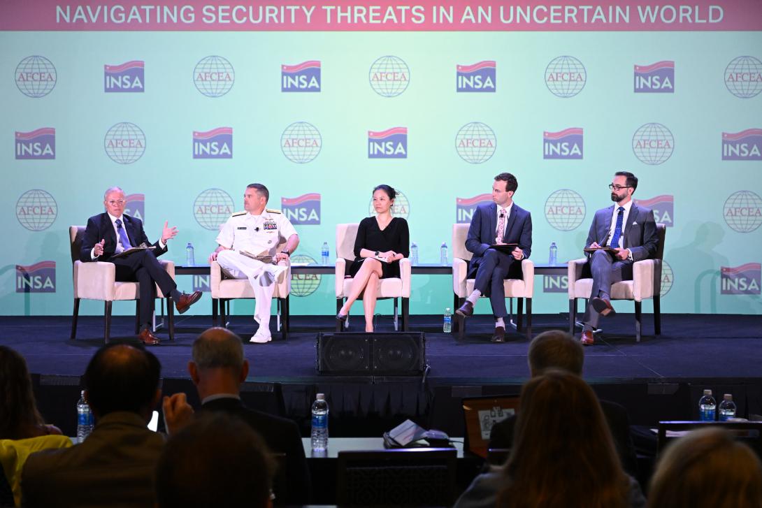 Lt. Gen. Robert "Bob" Ashley, USA (Ret.); Rear Adm. Thomas Henderschedt, USN; Bonny Lin, Nathan Beauchamp-Mustafaga; and Gary Tripmacher discuss “China: the Long Game” Friday during the Intelligence and National Security Summit 2023 panel held in National Harbor, Maryland.