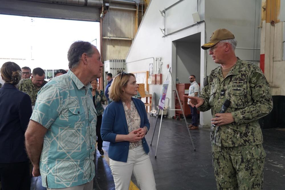Deputy Secretary of Defense Kathleen Hicks, center, speaking with officials at Pearl Harbor Naval Shipyard in July, emphasized that the Department’s Microelectronics Commons effort to greatly scale domestic production of semiconductors was needed in order to face the threats from near-peer adversaries, such as China. Credit: Justice Vannatta, Pearl Harbor Naval Shipyard 