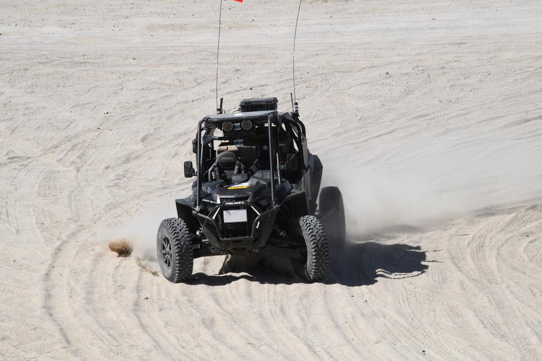 A RACER robotic vehicle achieves a checkpoint and orients itself to the next objective. The second and final phase will include tracked vehicles weighing approximately 9 tons, maps and global planning and tactics capabilities. Credit: DARPA image