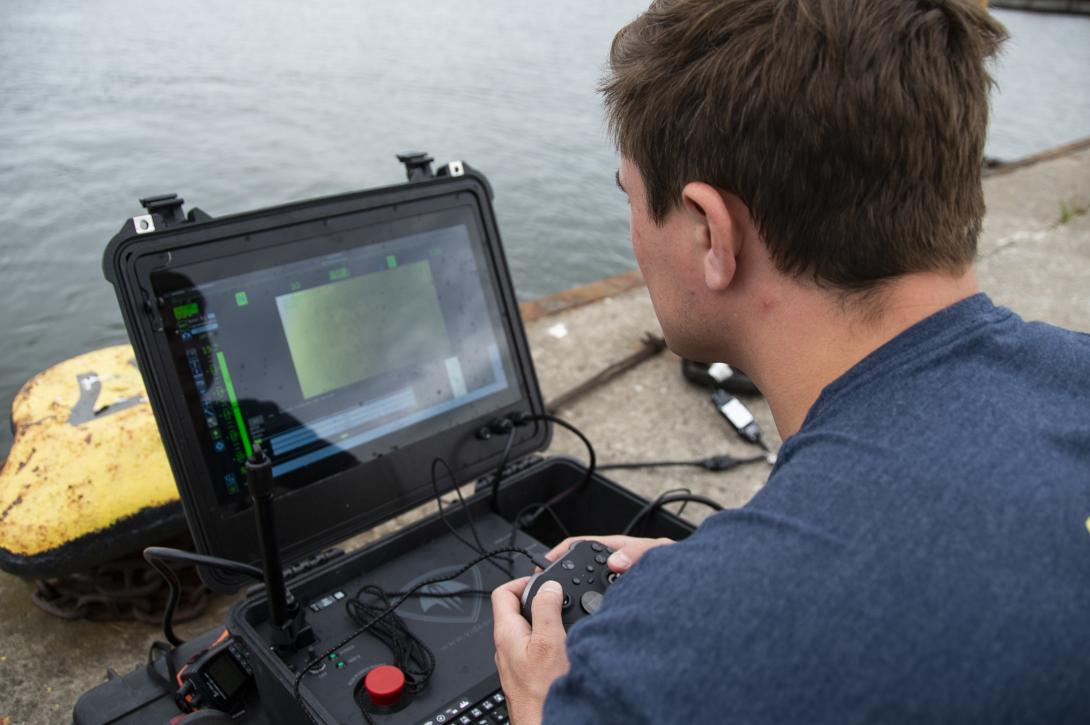 An equipment operator uses an underwater drone to inspect a Latvian pier in Liepaja, Latvia. Credit: Mass Communication Specialist 2nd Class Andrew Waters, U.S. Navy.