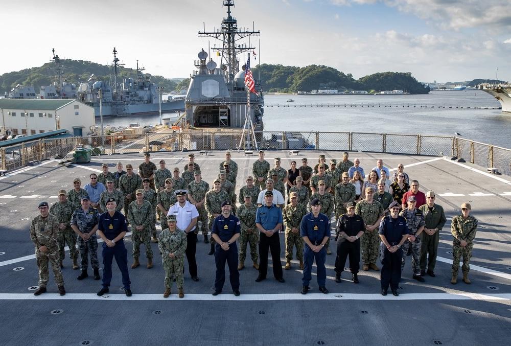 Senior military leaders from Australia, Canada, Japan, New Zealand, the United Kingdom and the United States stand together on the flight deck of the USS Blue Ridge (LCC-19), U.S. 7th Fleet on September 12, 2023, during the 2023 Information Warfare Waterfront Conference in Yokosuka, Japan. The United States must increase its information warfare capabilities in a complex geopolitical environment. U.S. Navy Photo by Mass Communication Specialist 2nd Class Caitlin Flynn