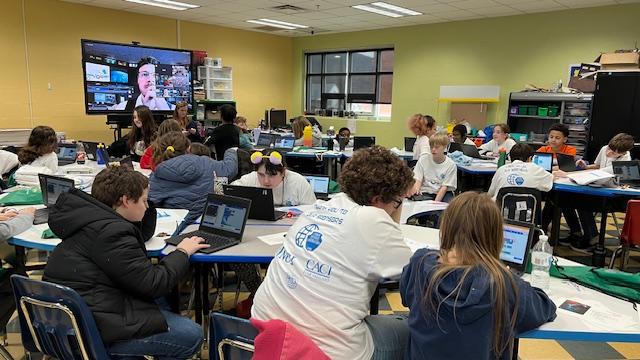 Tom Perry, president and CEO at VG Systems LLC—and the VASA Mission Director leads 5th grade students during the annual Code-A-Thon event, encouraging students to learn about cybersecurity and STEAM topics.