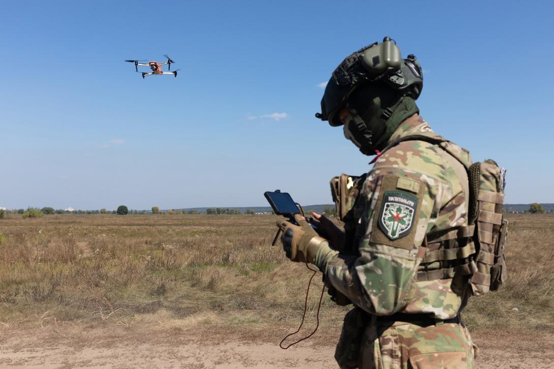 A drone operator launches a quadrocopter to search for the wounded on the battlefield in the Kyiv region. Credit: Drop of Light/ Shutterstock