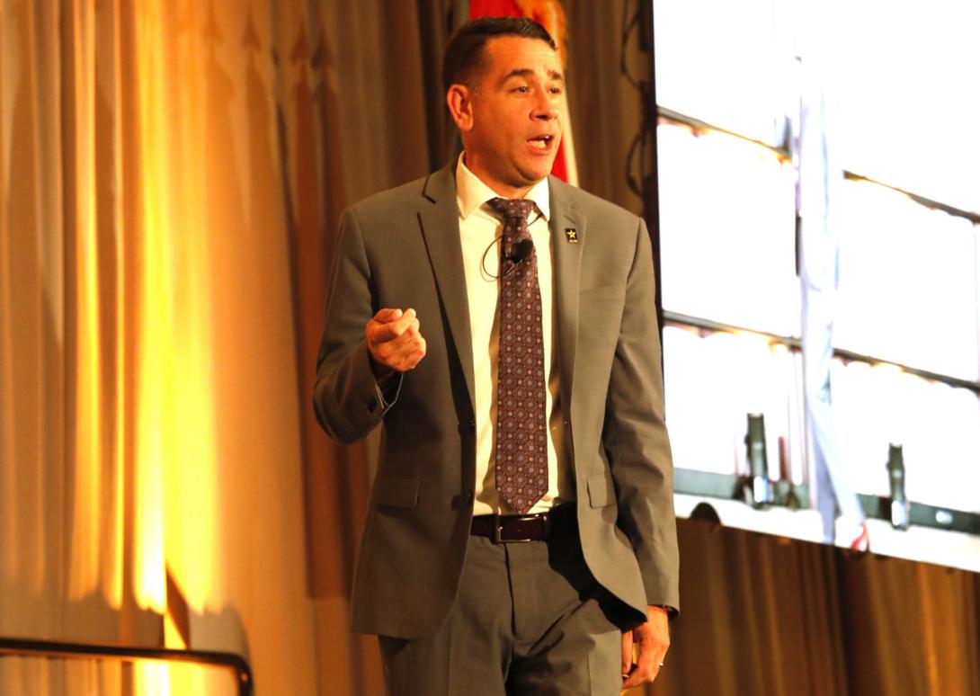 Army CIO Leonel Garciga addresses the audience at TechNet Augusta 2024.