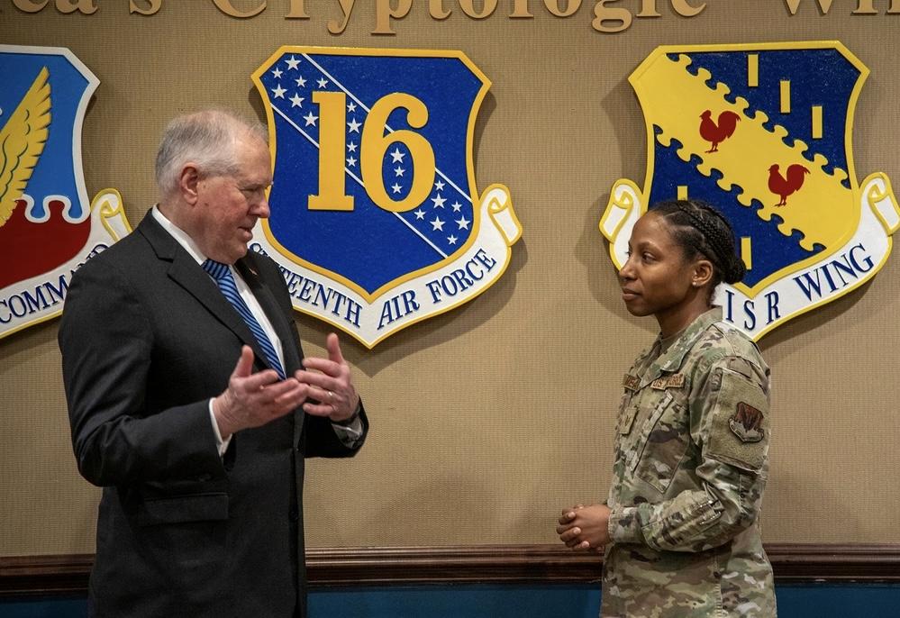  Secretary of the Air Force Frank Kendall speaks with U.S. Air Force Tech. Sgt. Shannon Meads, 70th Operations Support Squadron publicly available information operations noncommissioned officer in charge, during a visit at Fort Meade, Maryland on February 2, 2024. The 16th Air Force is targeting “deliberate partnerships,” to aid its information warfare efforts. Credit: U.S. Air Force photo by Tech. Sgt. Kevin Iinuma