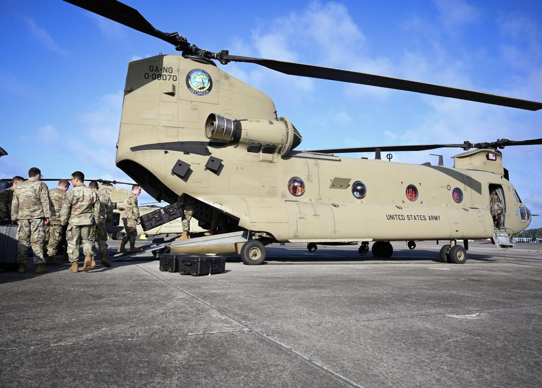 U.S. Air Force cyber operators and maintainers with the 103rd Air Control Squadron, Connecticut Air National Guard, load a Tactical Operations System-Lite (TOC-L) kit onto a U.S. Army CH-47 Chinook in Savannah, Georgia on May 15, 2024. As part of exercise Sentry Savannah, the 103rd ACS made history as the first National Guard unit to successfully deploy and establish a cloud-based radar and radio connection from an austere location using the TOC-L. Credit: U.S. ANG photo by Master Sgt. Morgan Whitehouse