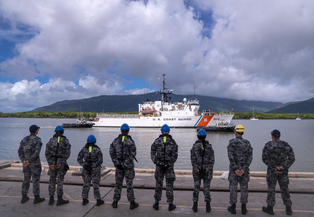 U.S. Coast Guard Cutter Harriet Lane (WMEC 903) crew members pull in slack on an aft mooring line to secure the cutter to a pier at HMAS Cairns, Queensland, Australia, March 7, 2024. The cutter is one part of the U.S. Department of Defense’s effort to help combat illicit maritime activities in the Indo-Pacific region.