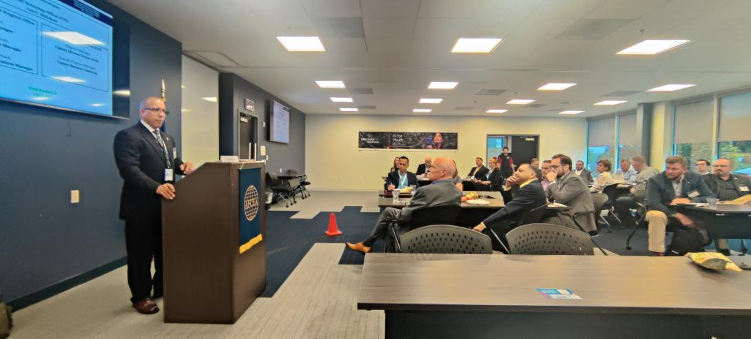 Marines' CTO Luis Velazquez speaks at an AFCEA Quantico event. Credit: Diego Laje, AFCEA.