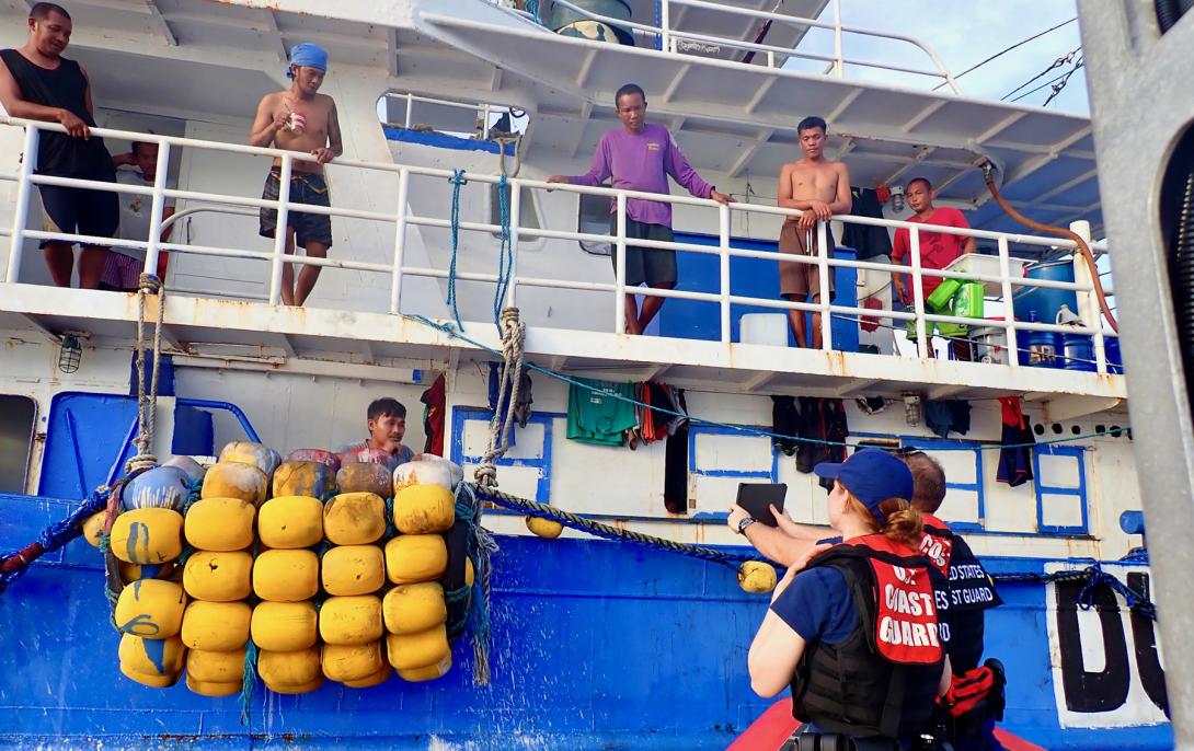 The USCGC Frederick Hatch conducts fisheries boardings in the Palau exclusive economic zone and addresses a Philippine crew using translations on a tablet. Credit: U.S Coast Guard