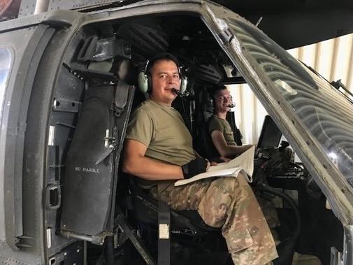 Sgt. Ramiro Aleman, 1106th Aviation Group, installs software upgrade change package on a UH-60M Black Hawk helicopter at Camp Taji, Iraq in July 2019. The Army’s mandate for a software bill of materials, known as an SBOM, is meant to strength the service’s software supply chain, which ultimately better protects the warfighter. U.S. Army National Guard photo by Sgt.Thomas Braune