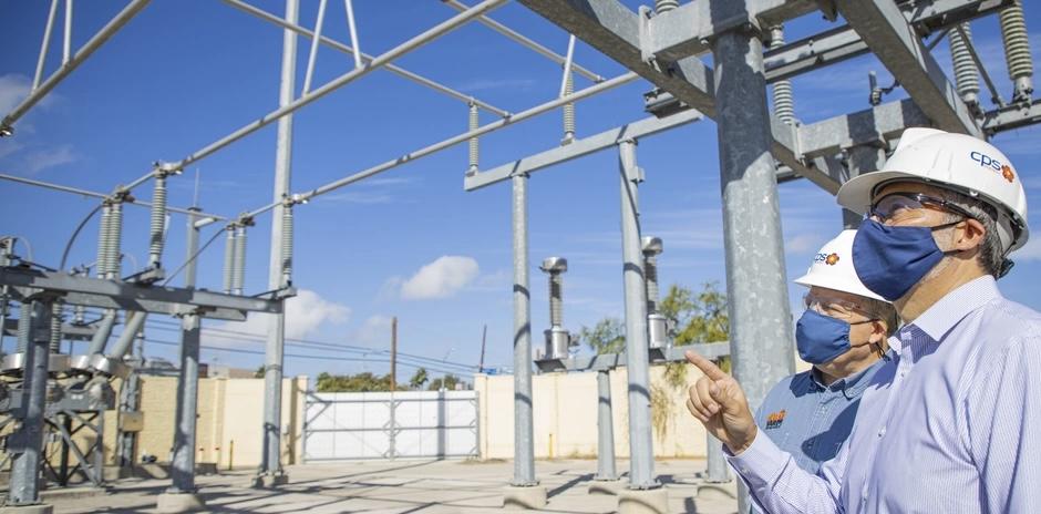 Officials from CPS Energy in 2020 look at security measures at an area substation, as part of an effort with Joint Base San Antonio and other organizations to increase energy security and resiliency. The base must continue to look at not only energy and power supplies, but also water source security in this era of great power competition. Photo from Lori Bultman, 502nd Air Base Wing, San Antonio.