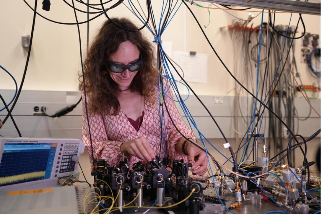 Esther Baumann, research scientist, National Institute of Standards and Technology, works on part of the advanced laser-based technology. Credit: R. Jacobson/NIST
