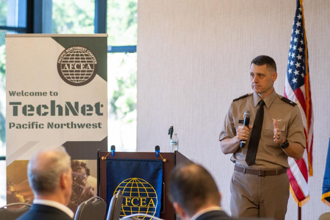 Col. Tyler Oxley, chief information officer/G6, 94th Army Air and Missile Defense Command, addresses the audience at TechNet Pacific Northwest 2025 at Joint Base Lewis-McChord in Tacoma, Washington. Credit: Justin Manuel