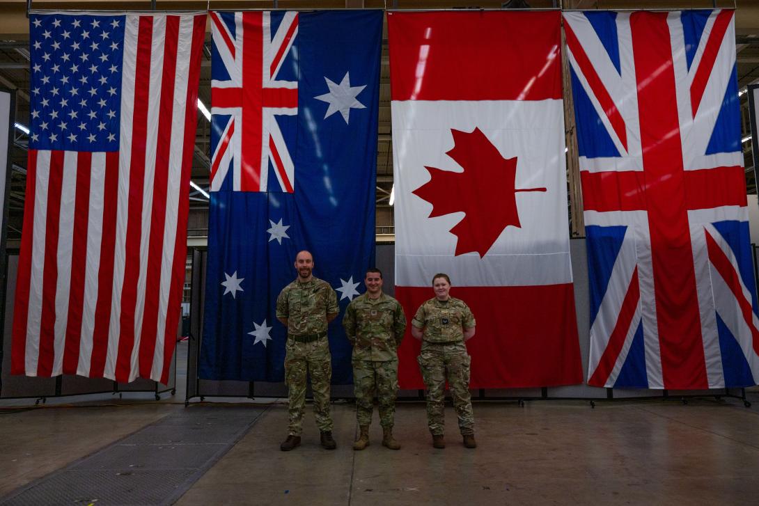 The third iteration of 18th Space Defense Squadron‘s ‘Operator Exchange’ welcomed members from the U.K. Space Operations Centre (UKSpOC), including (from left to right) Royal Air Force (RAF) Flying Officer Hallchurch, UKSpOC, space duty officer; U.S. Space Force Capt. Dustin Pessatore, 18 SDS sharing coordinator; and RAF Corporal Coulson, UKSpOC space analyst, at 18 SDS’s High Bay at Vandenberg Space Force Base, California, on February 13, 2023.  Credit: U.S. Space Force photo by Tech. Sgt. Luke Kitterman