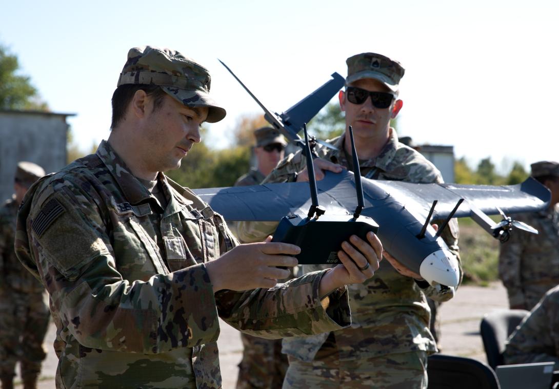 Chief Warrant Officer 2 Christian R. Lehr (l) and Sgt. 1st Class Andrew J. Baumgardner (r), members of the 2nd Multi-Domain Effects Battalion Innovation Center, perform pre-flight checks prior to testing the MDEB’s newest experimental unmanned aerial vehicle on May 11, 2025, in Ustka, Poland. Arcane Thunder 25 promotes innovation, collaboration and interoperability between Allied and partner nations. Credit: Sgt. 1st Class John Healy