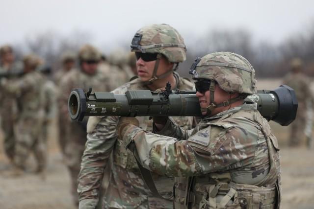 Pfc. Gualberto Zarate, guided by Sgt. Antonio Rodriguez, fires an AT4 Rocket Launcher with a 9 mm tracer round at Novo Selo Training Area, Bulgaria, on March 12, 2025, assigned to 4th Battalion, 6th Infantry Regiment, 3rd Armored Brigade Combat Team, 1st Armored Division. The Army named the 3rd Armored Brigade Combat Team as one of the next units to take part in Transforming in Contact 2.0 initiative. Credit: U.S. Army photo by Spc. Kyle Kimble