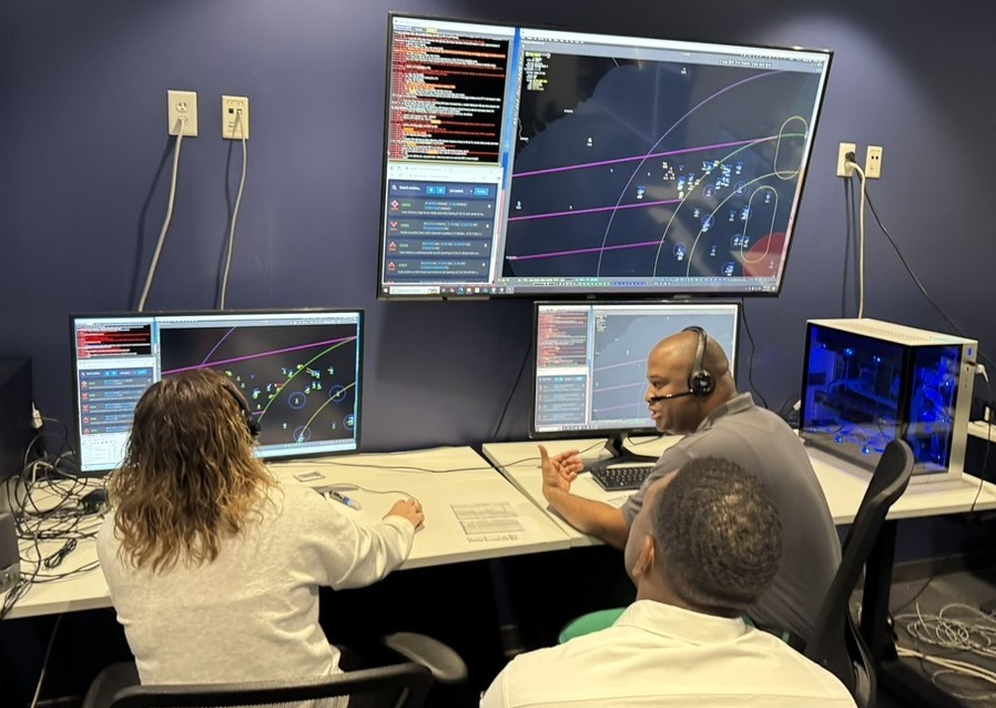 U.S. Air Force air battle managers participate in the Department of the Air Force’s Advanced Battle Management System Cross-Functional Team first Decision Advantage Sprint for Human-Machine Teaming, or DASH, experiment, held at the Howard Hughes Operations Center in Las Vegas, on April 8, 2025. (The image has been cropped to focus on the subjects.) Credit: U.S. Air Force photo