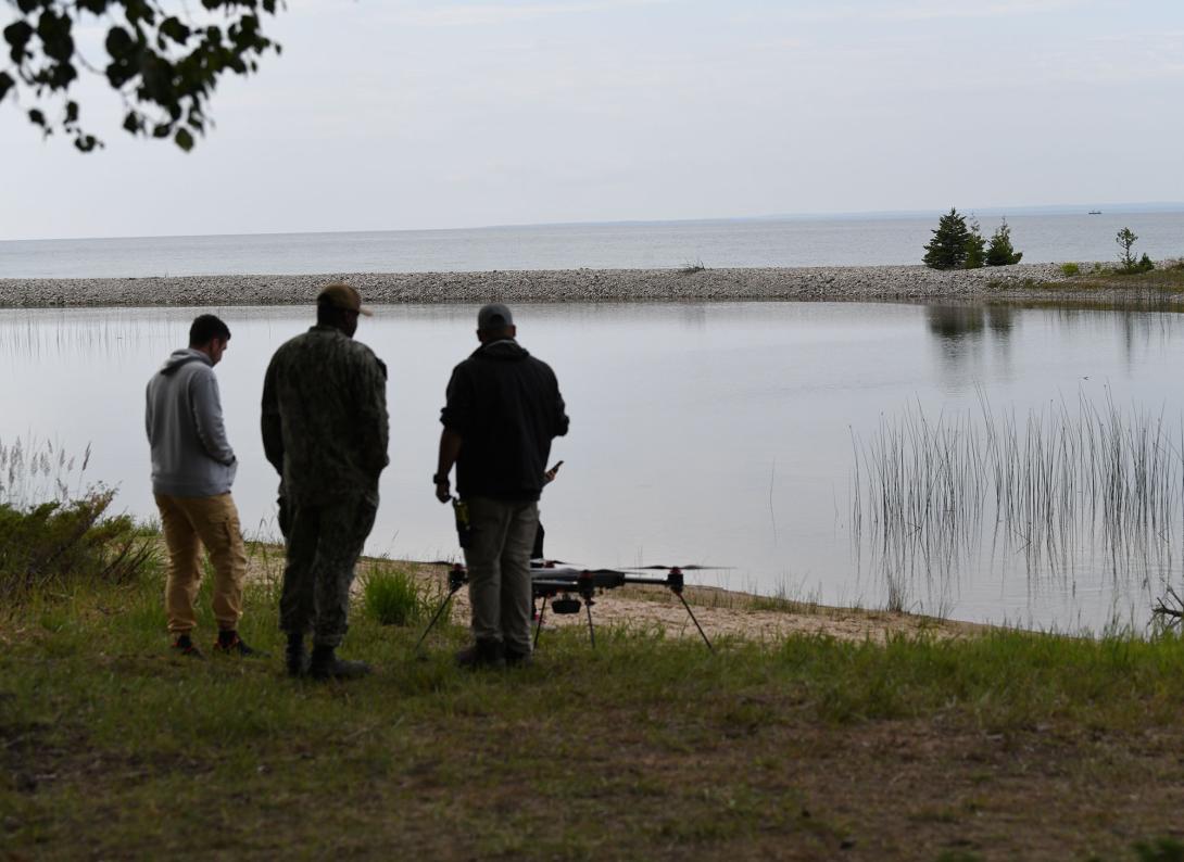 U.S. civilian contractors conduct tests of emerging electromagnetic advanced technology with Naval Surface Warfare Center Crane Division in Alpena, Michigan, during Exercise Silent Swarm, July 2023. Credit: U.S. Army National Guard photo by Maj. Megan Breen 