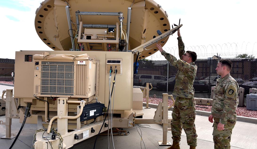 Spc. Klay Walker and Spc. Alexander Best with the 4th Space Company, 1st Space Battalion, work on a Mobile Integrated Ground Suite at Fort Carson, Colorado. U.S. Army Photo by Dottie White