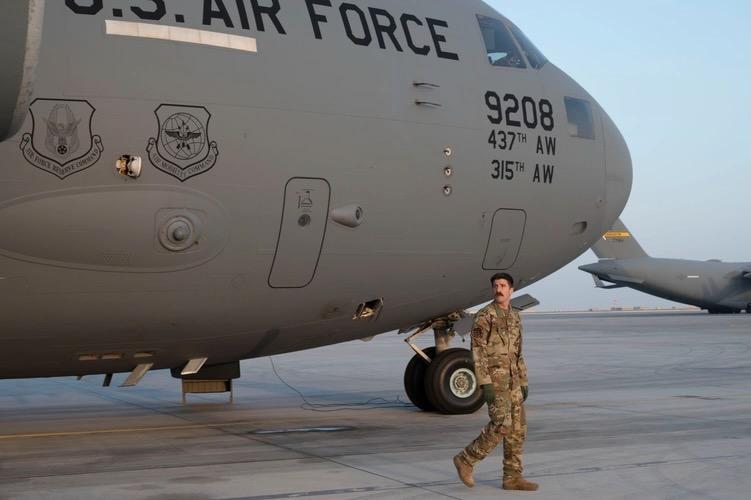 U.S. Air Force Capt. Mitch Dobson, 15th Expeditionary Airlift Squadron pilot, conducts a preflight check on a C-17 Globemaster III at Al Udeid Air Base, Qatar, June 23, 2023, in support of Air Force Central and U.S. Central Command.. Credit: U.S. Air Force photo by Staff Sgt. Emily Farnsworth