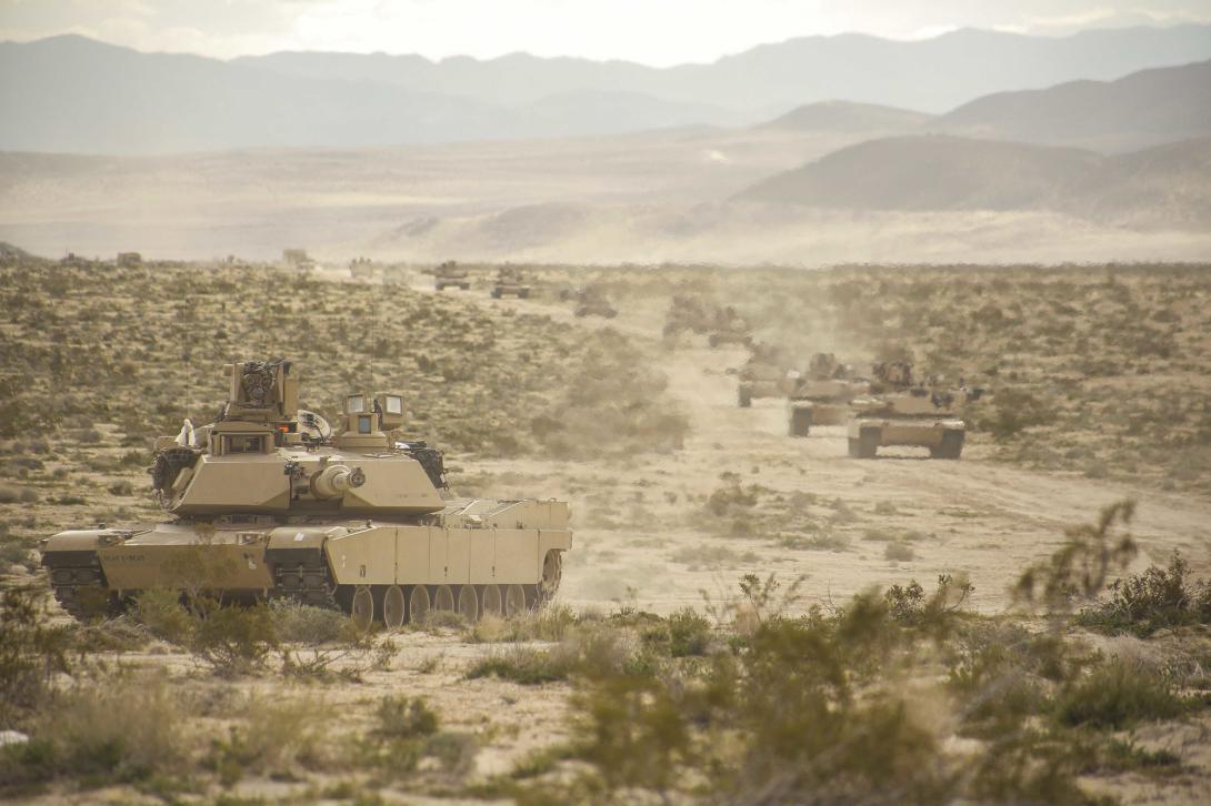 D2D-enabled vehicles could reduce the risk to life, according to a subject matter expert. Pictured are tanks caravanning across a desert in 2017. Credit: U.S. Army photo by Spc. JD Sacharok, Operations Group, National Training Center