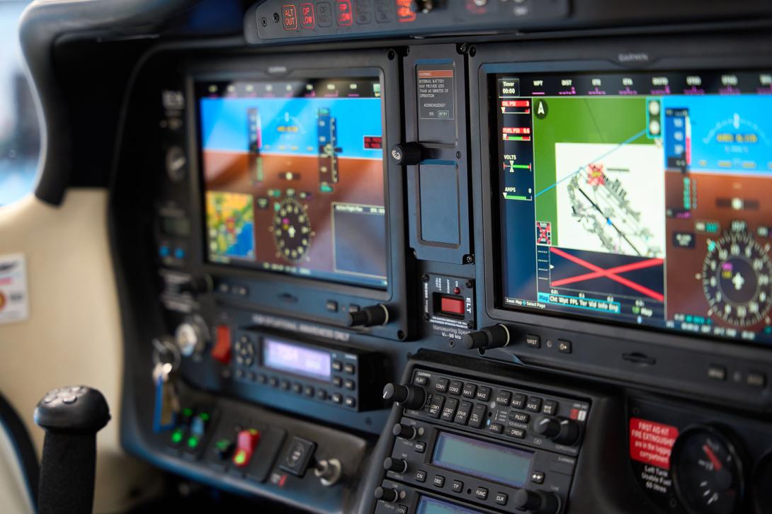 A modern aircraft cockpit control panel with navigation system displays a flight route. Credit: alvaro-stock.adobe.com