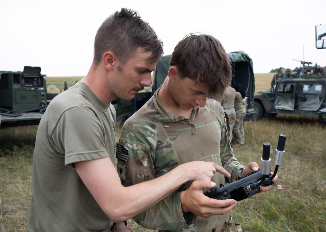 U.S. Army Staff Sgt. Jonathon Melvin (l) instructs U.S. Army Spc. Max Boatner on drone flight operations at Norio Training Area, Georgia, in August, during Agile Spirit 25. Both soldiers are assigned to Hawkeye Platoon, Headquarters and Headquarters Troop, 1st Squadron, 91st Cavalry Regiment, 173rd Airborne Brigade. The team leveraged small unmanned aircraft systems to demonstrate aerial resupply and mission-specific payload deployment using custom 3D-printed attachments.  U.S. Army National Guard photo