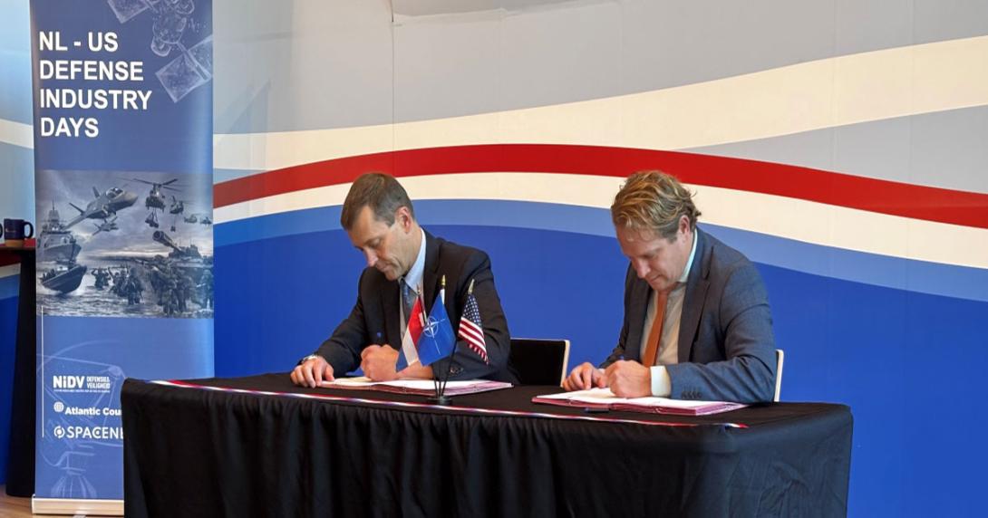 GA-ASI CEO Linden Blue (left) and Dutch Minister for Arms Procurement and Personnel Gijs Tuinman (right) sign an agreement. Credit: GA-ASI