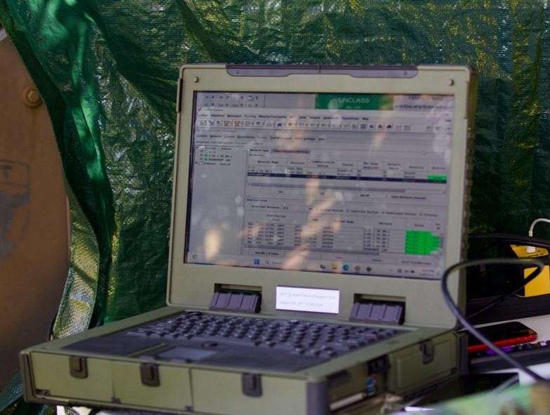 U.S. Soldiers with 1st Battalion, 109th Infantry Regiment, 2nd Infantry Brigade Combat Team, 28th Infantry Division, operate an unmanned aerial system and call for artillery fire during a demonstration at Fort Indiantown Gap, Pennsylvania, in July. Credit: U.S. Army National Guard photo by Maj. Travis Mueller