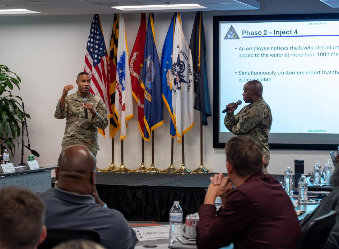 Maryland Army National Guard Col. Louis Patrick Hawkins Jr., and Maryland Air National Guard Lt. Col. Michael S. Graham Jr., lead Maryland National Guardsmen and civilian security and infrastructure cybersecurity experts in a tabletop exercise during the third day of the State of Maryland Critical Infrastructure Cyber Resilience Workshop.  U.S. Air National Guard Photo by Airman 1st Class Sarah Hoover