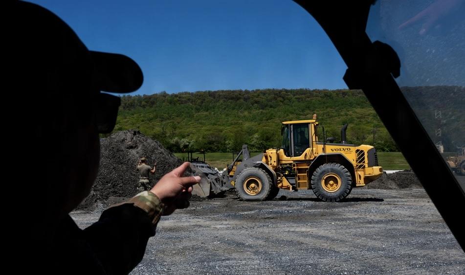 U.S. Air Force Master Sgt. Phillip Rubalcava, a superintendent at the 316th Civil Engineer Squadron, oversees front-end loader training during a bivouac exercise held by the wing at Fort Indiantown Gap, Pennsylvania on April 27, 2026. The Cybersecurity and Infrastructure Security Agency is beginning a new program called Critical Infrastructure Fortify, or CI Fortify,  which will conduct assessments of military land other critical infrastructure. Credit: Airman 1st Class Patrick Nigugana