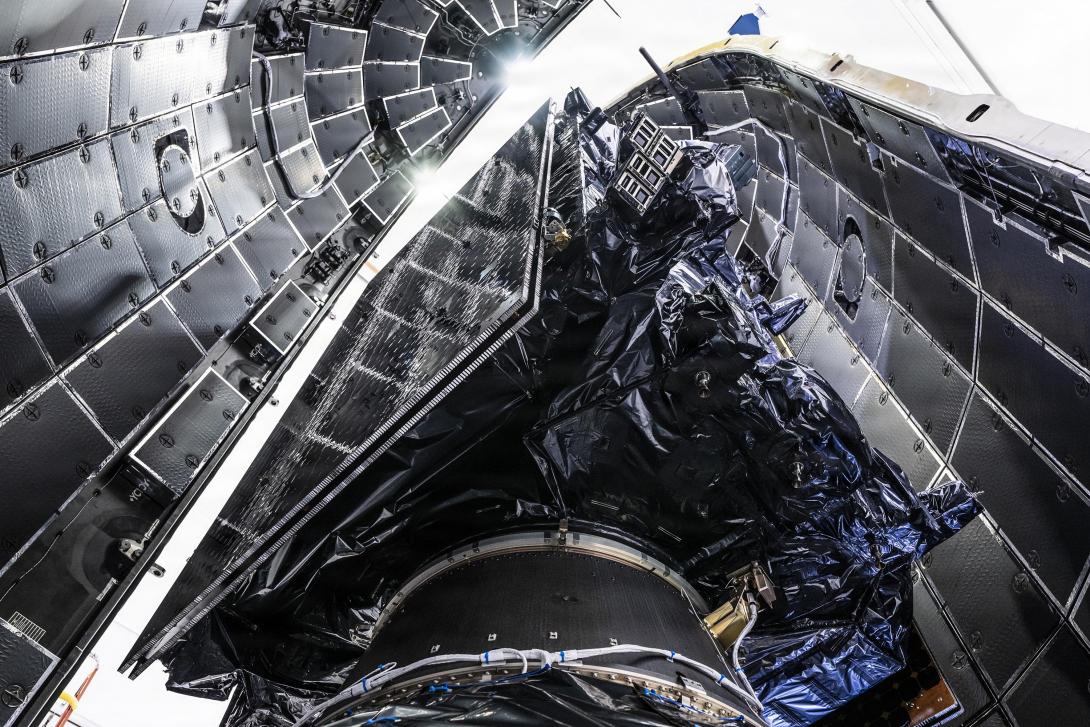 A Lockheed Martin GPS III satellite is encapsulated into the fairings of a SpaceX Falcon 9 Rocket in preparation for the National Security Space Launch GPS III-8 mission, Cape Canaveral Space Force Station, Florida, April 15, 2026. Credit: Maj. Brittany Curry