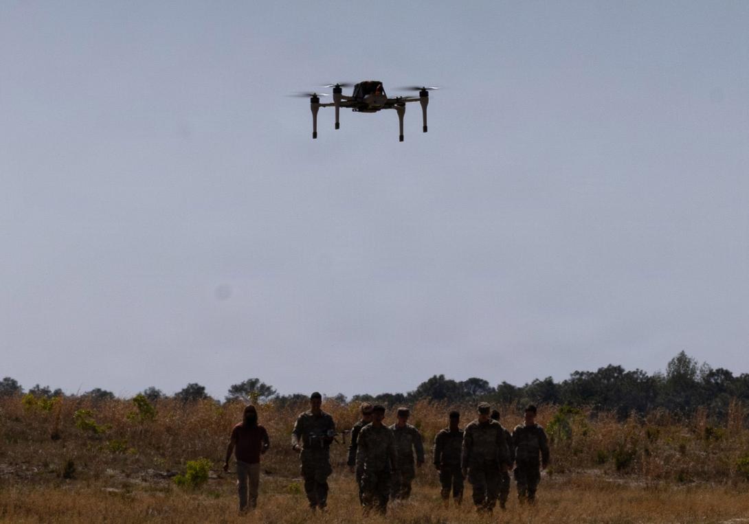 A bumblebee drone flies in front of a group of 82nd Airborne Division Soldiers at Fort Bragg, North Carolina, in April. Credit: U.S. Army Photo by Staff Sgt. Cory Reese