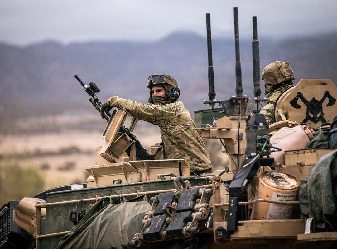 Spc. Hayzin Zappanti, an armor crewmember assigned to Bravo Company, 1st Battalion, 66th Armor Regiment, 3rd Armored Brigade Combat Team, 4th Infantry Division, provides security during Ivy Mass on Fort Carson, Colorado, May 5, 2026. Ivy Mass validated large-scale combat operations while integrating Next Generation Command and Control capabilities to enhance situational awareness, data sharing, and decision-making across the formation. Credit: U.S. Army photo by Spc. Thomas Nguyen